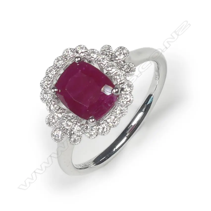 A 14ct white gold ruby and diamond halo ring Image 1++