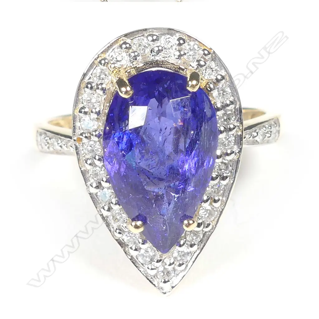 A 14ct gold tanzanite and diamond ring Image 1++