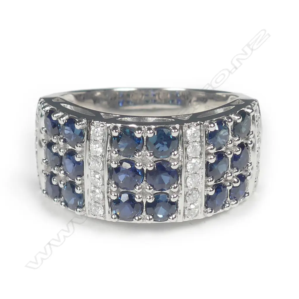 A 14ct white gold sapphire and diamond ring Image 1++