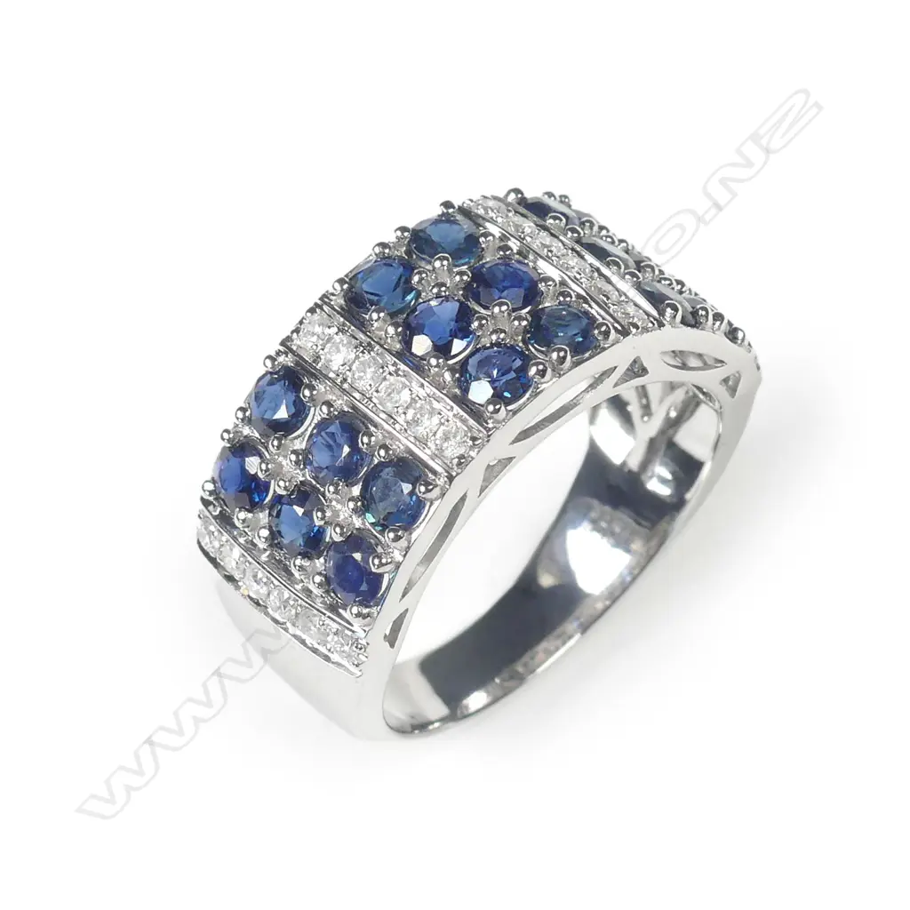 A 14ct white gold sapphire and diamond ring Image 1++