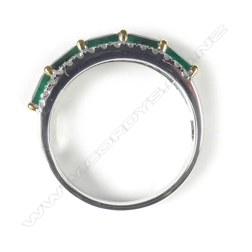 A platinum emerald and diamond ring Image 1++