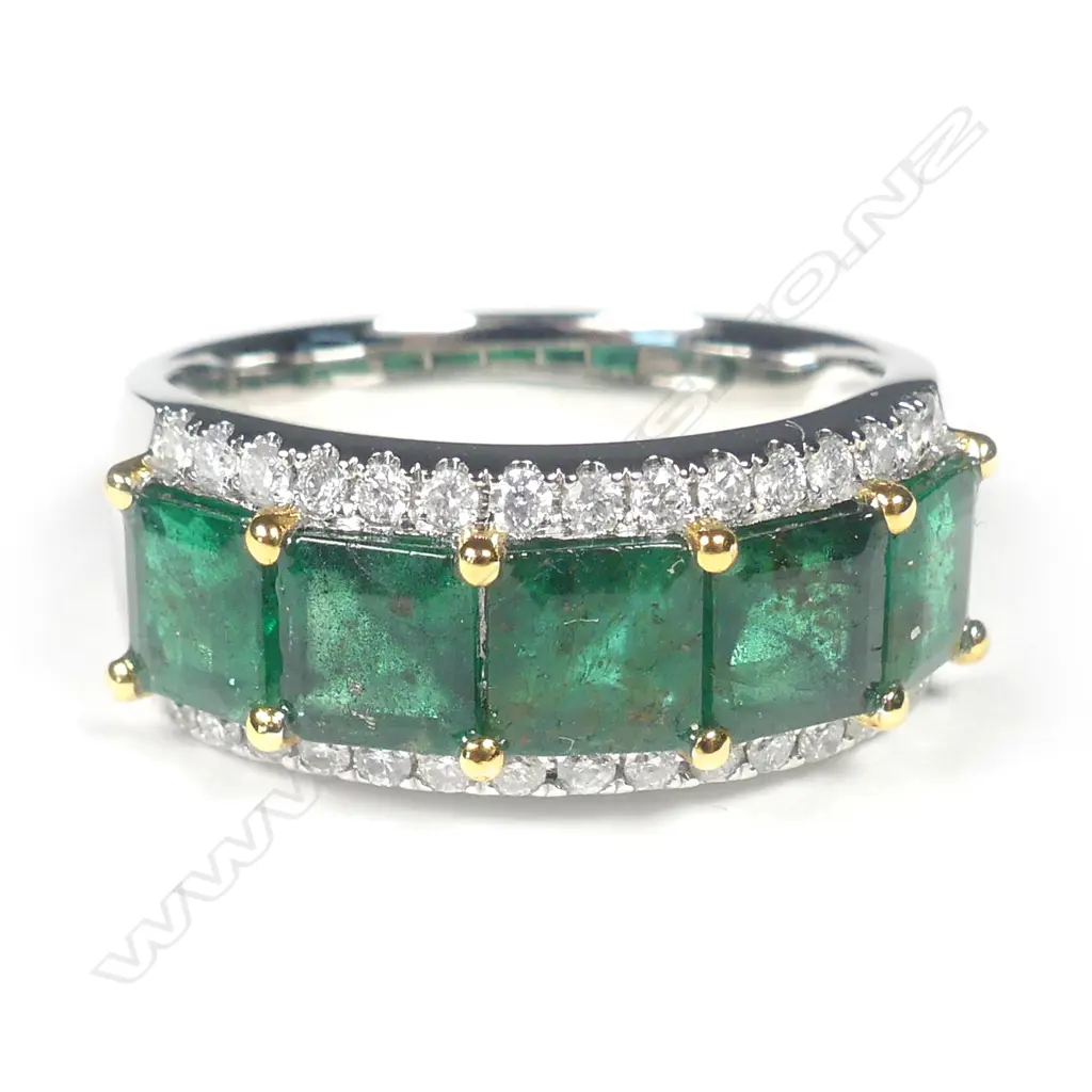A platinum emerald and diamond ring Image 1++