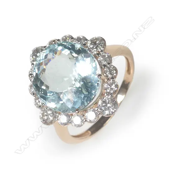 A 14ct rose gold aquamarine and diamond halo ring