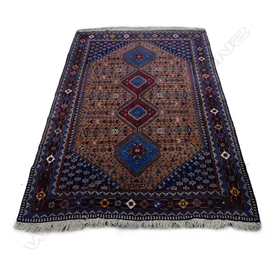 A Persian large wool on cotton carpet