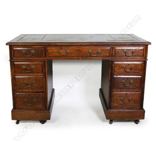 A Victorian oak twin pedestal desk