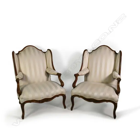 A pair of French style bergère wingback chairs