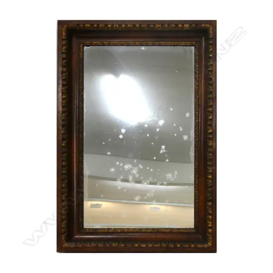 A Victorian walnut framed mirror