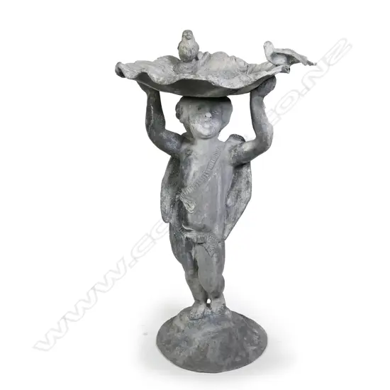 A vintage lead birdbath