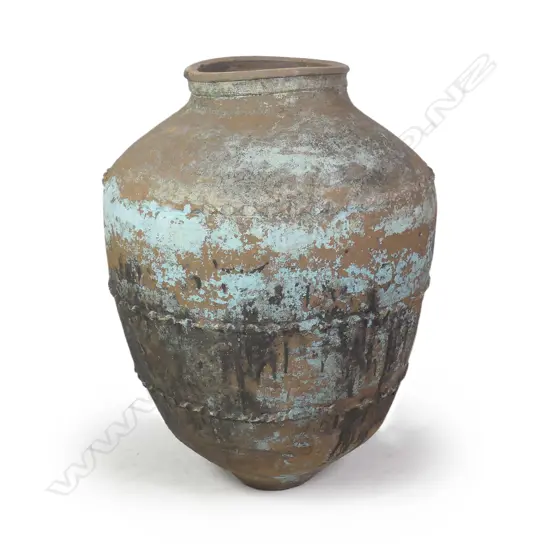 A large old terracotta tall olive oil storage jar