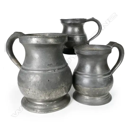 Three antique pewter mugs