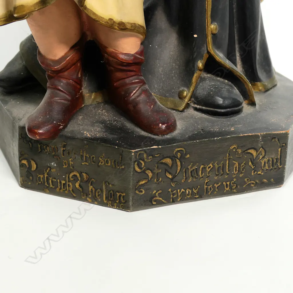 An early 20thC French terracotta religious figure group of St Vincent de Paul with two children Image 1++