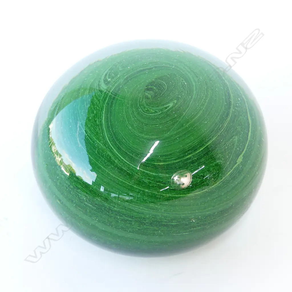 A late 19thC green glass paperweight Image 1++