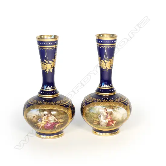 A pair of early 20thC Royal Vienna hand painted porcelain vases