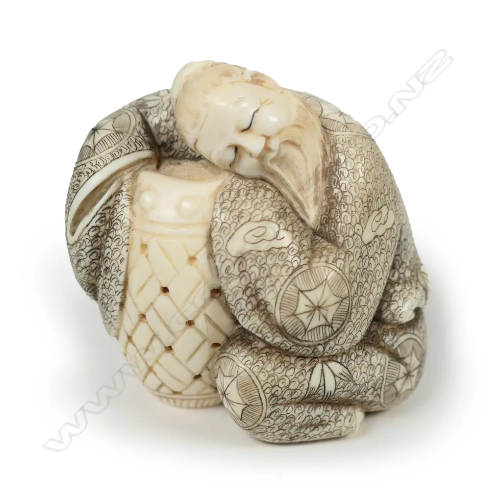 A Japanese carved ivory okimono Image 1++