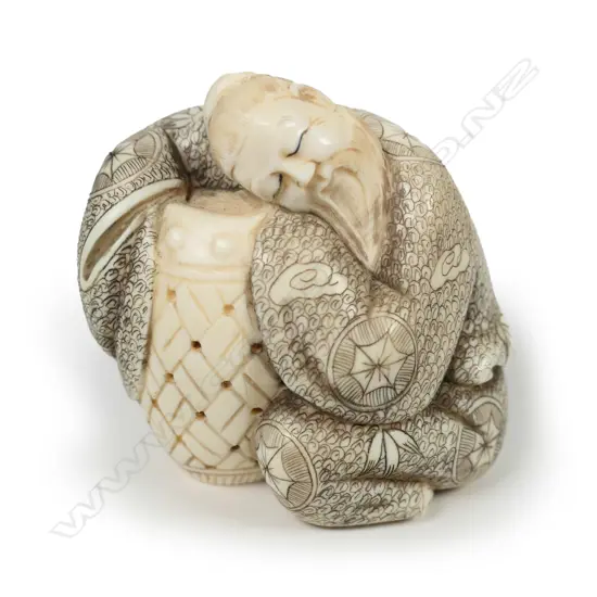 A Japanese carved ivory okimono