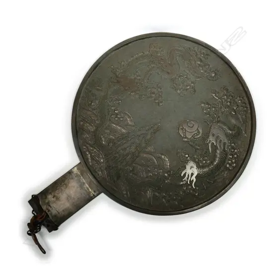 A large Chinese bronze mirror