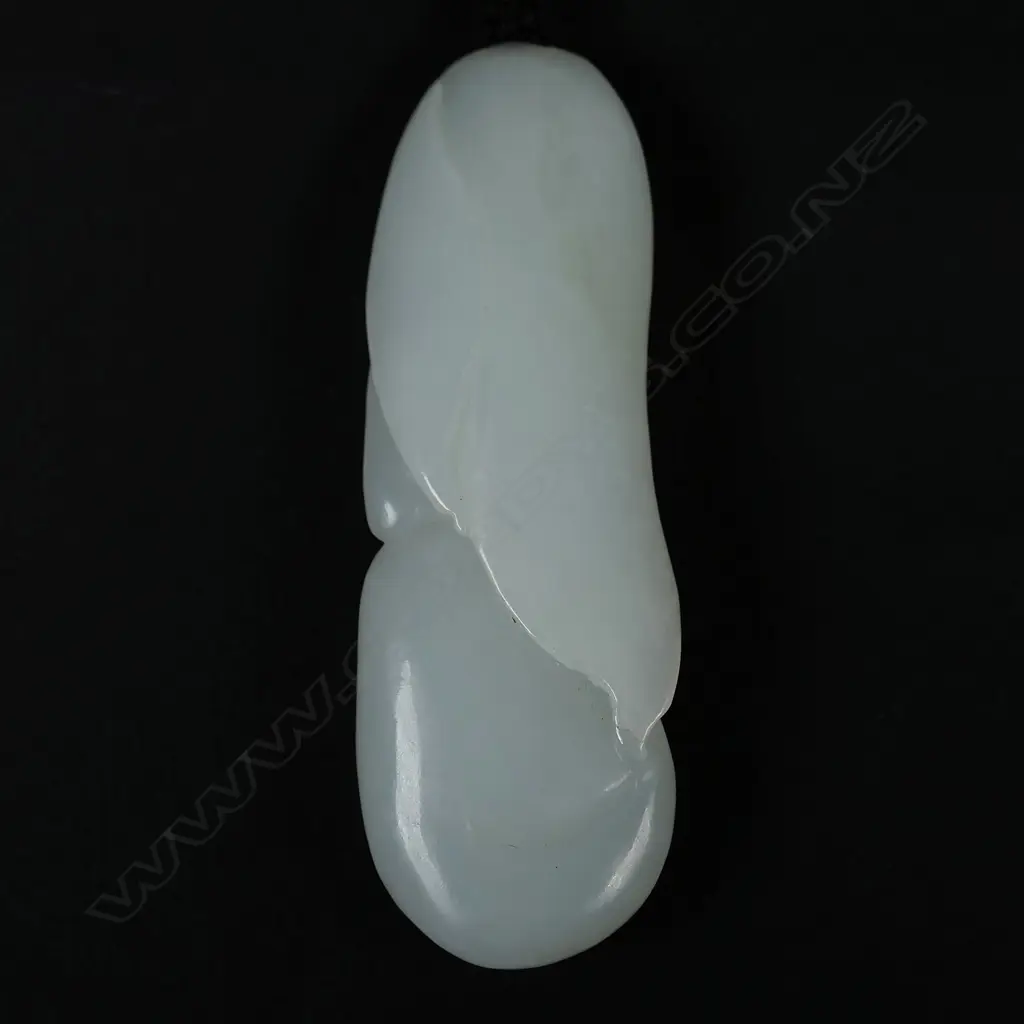 A Chinese white jade carved mermaid pendant Image 1++