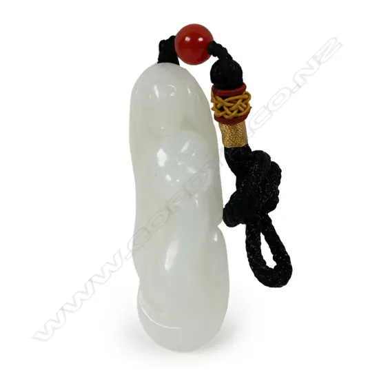 A Chinese white jade carved mermaid pendant