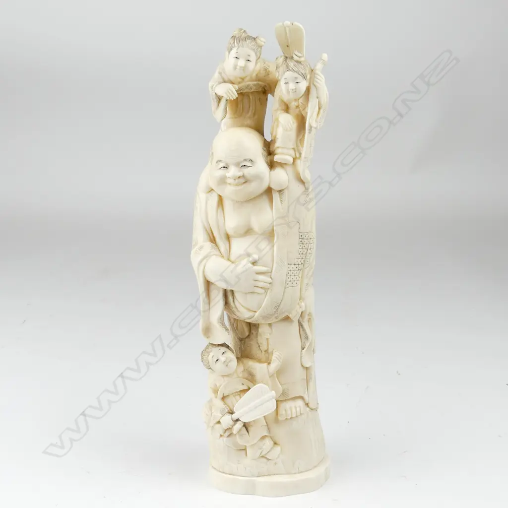 A tall old marine ivory carving of Hotei Image 1++