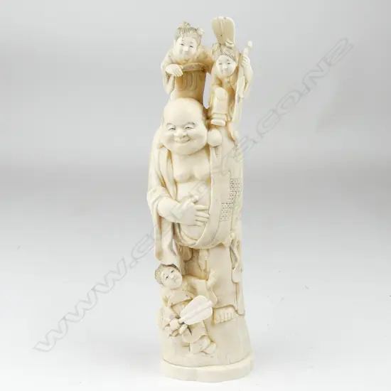 A tall old marine ivory carving of Hotei