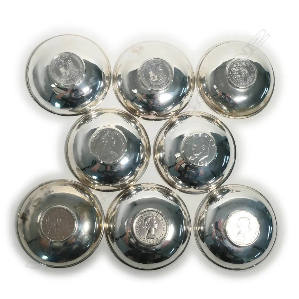 Eight small silver dishes set with coins to the centre Image 1++
