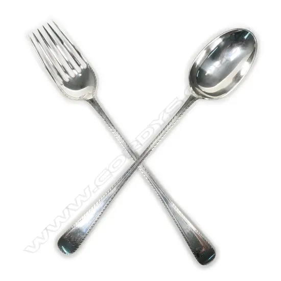 A pair of silver salad servers