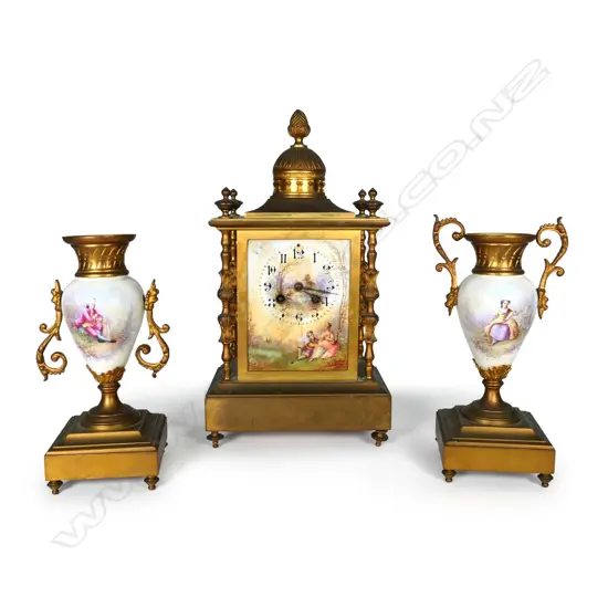 A 19thC French brass and porcelain clock and garniture