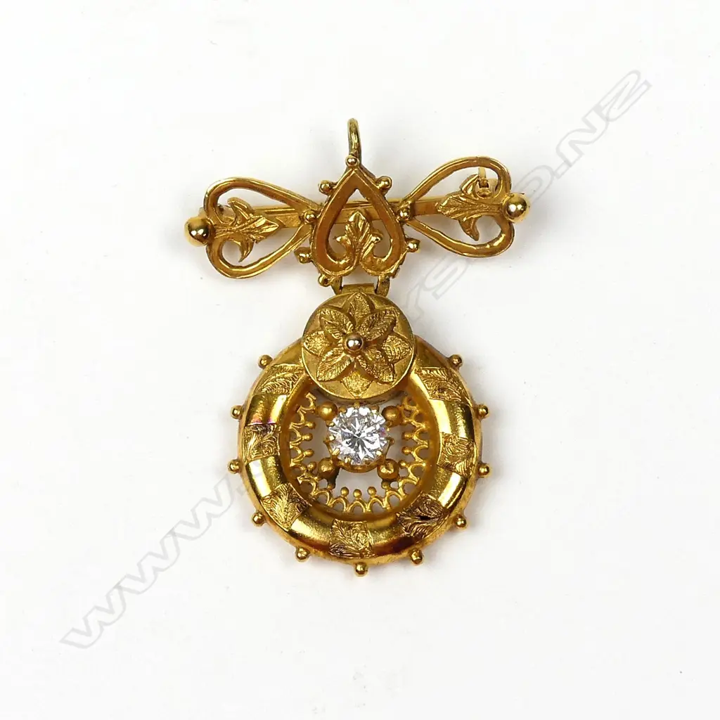 An antique 14ct. yellow gold and diamond suspended pendant brooch Image 1++