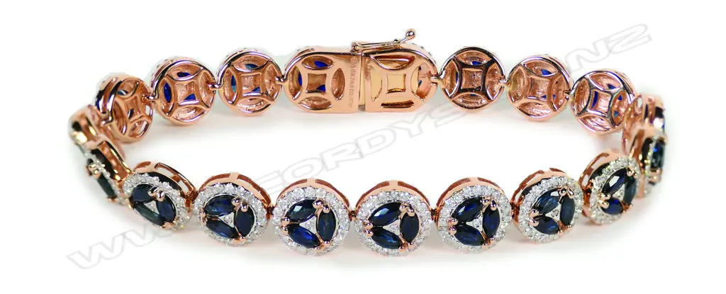 A 14ct rose gold sapphire and diamond halo bracelet Image 1++