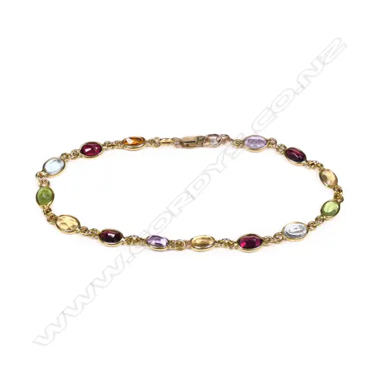 An 18ct and multi gemstone set bracelet