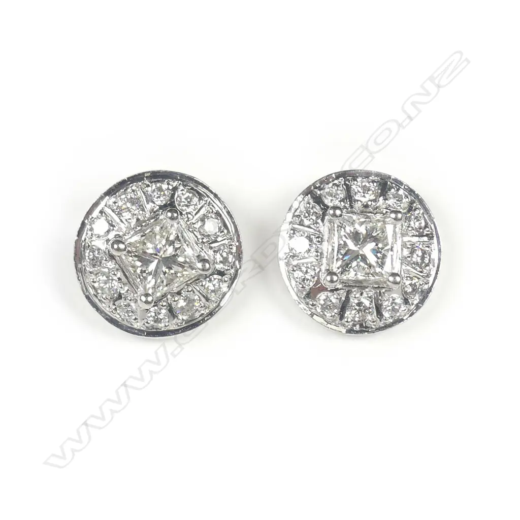 A pair of 9ct white gold and diamond earrings Image 1++