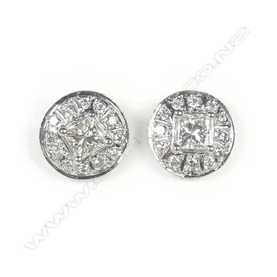 A pair of 9ct white gold and diamond earrings