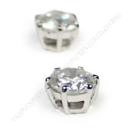 A pair of 14ct white gold white diamond stud earrings Image 1++