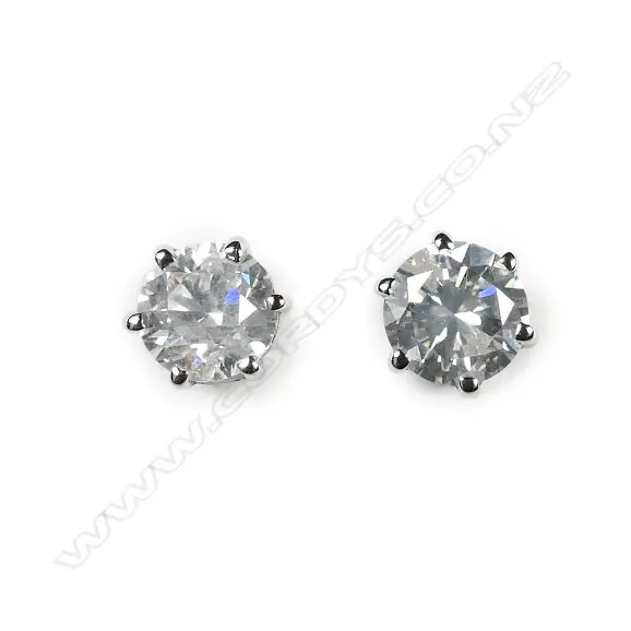A pair of 14ct white gold white diamond stud earrings Image 1++