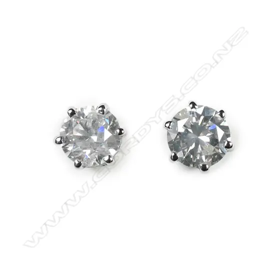 A pair of 14ct white gold white diamond stud earrings