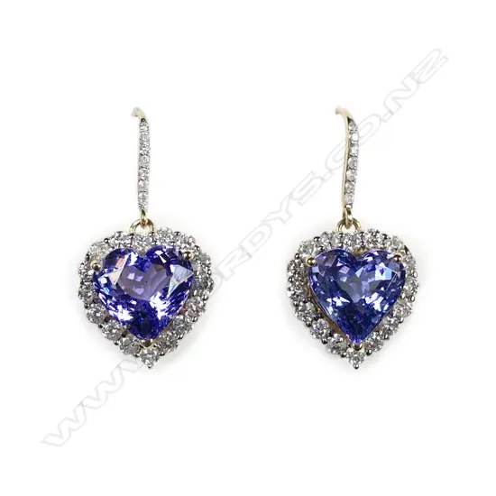 A pair of 14ct gold tanzanite and diamond halo earrings