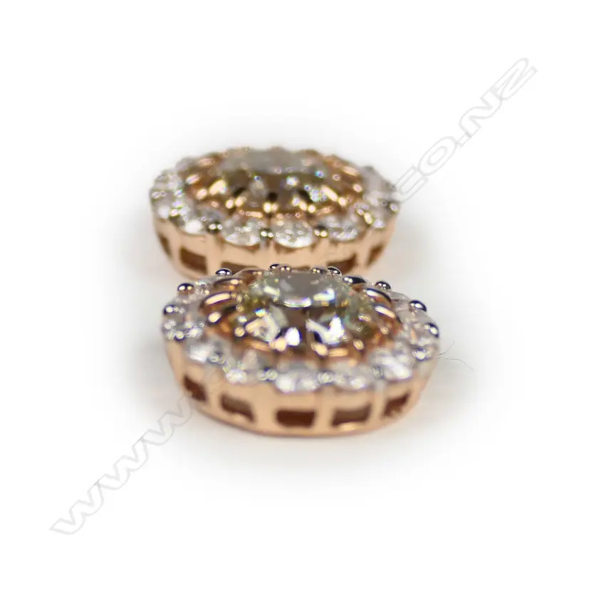 A pair of 14ct rose gold and diamond halo earrings Image 1++
