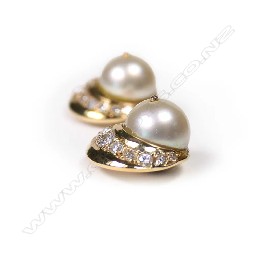 A pair of 18ct gold diamond and pearl earrings Image 1++