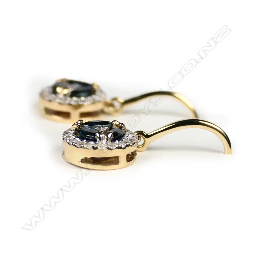 A pair of 14ct gold sapphire and diamond halo earrings Image 1++