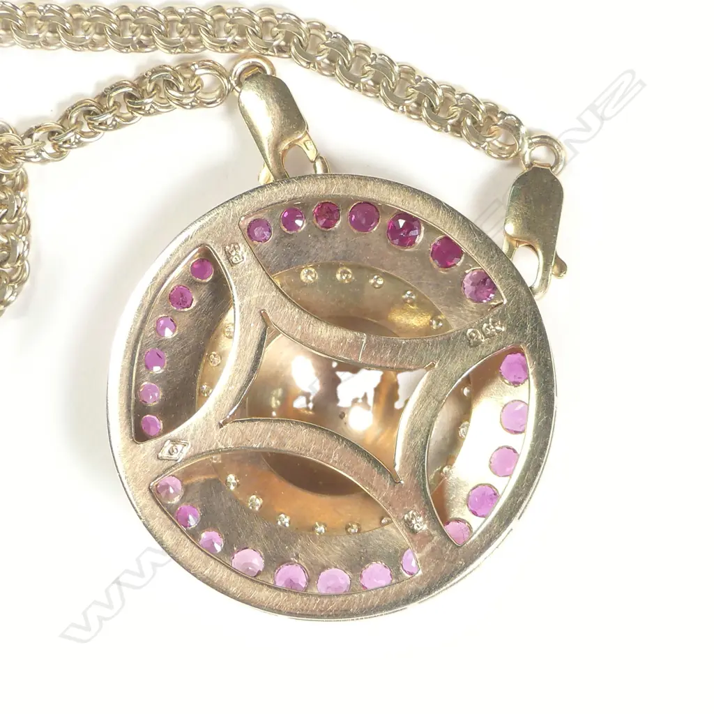 A 9ct gold ruby and diamond pendant Image 1++