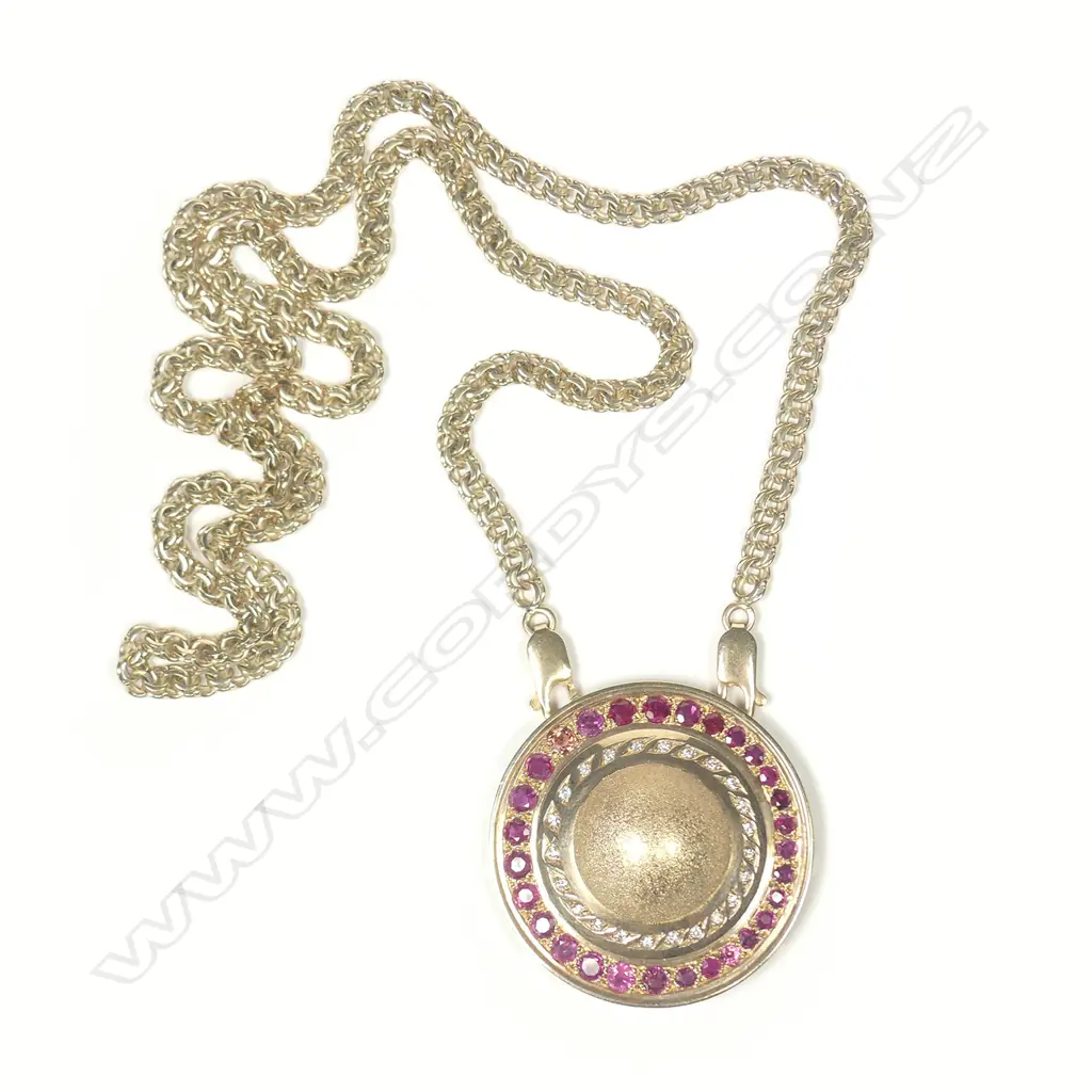 A 9ct gold ruby and diamond pendant Image 1++