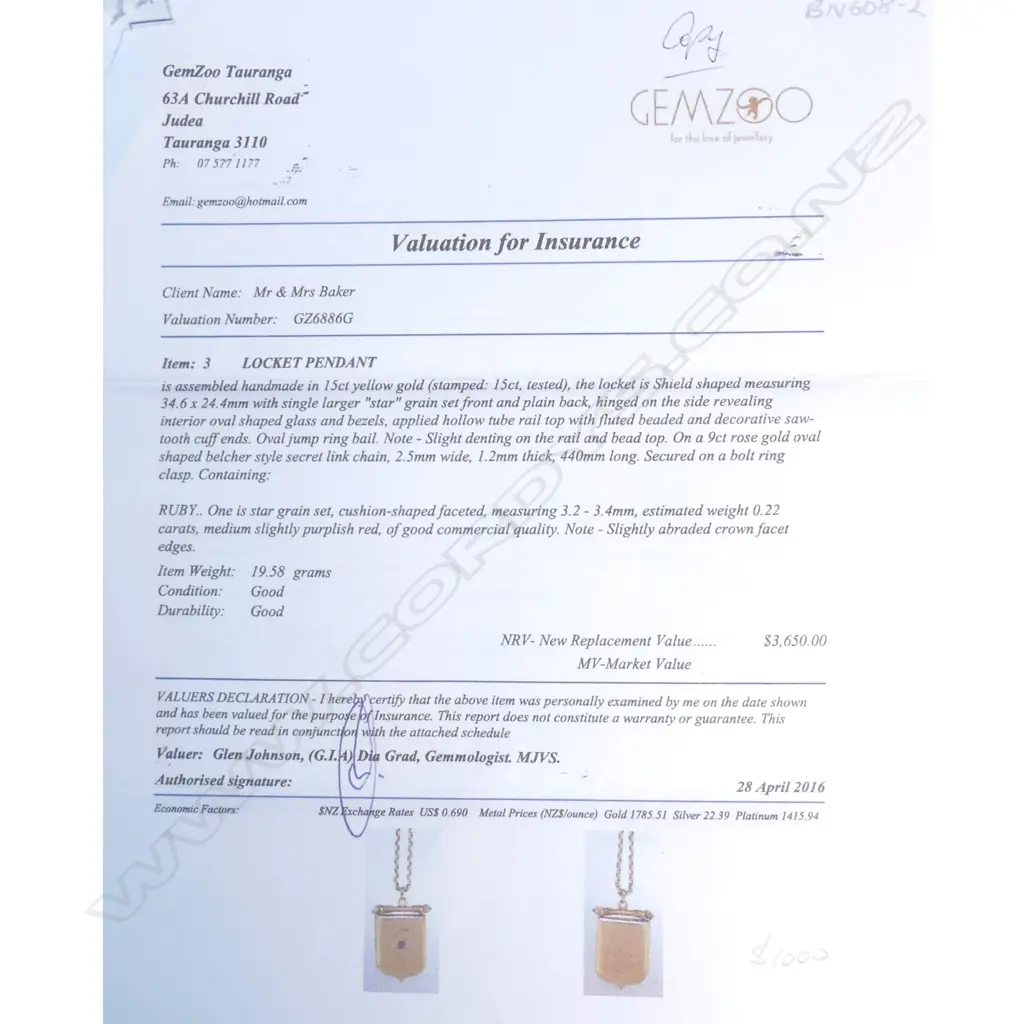 An Edwardian 15ct gold locket, shield form with small ruby star set to the front, (slight dent to bead top), the interior with glass for photos, together with a 9ct rose gold chain, 19.58gm. Valuation available. Image 1++