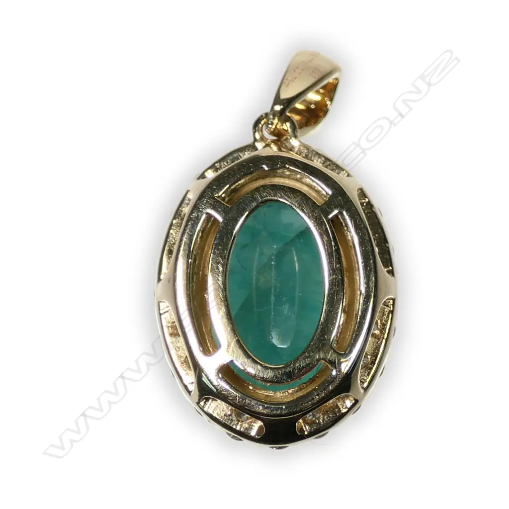 A 14ct yellow and white gold emerald and diamond halo pendant Image 1++