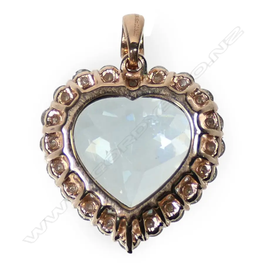 A 14ct rose gold aquamarine and diamond halo pendant Image 1++