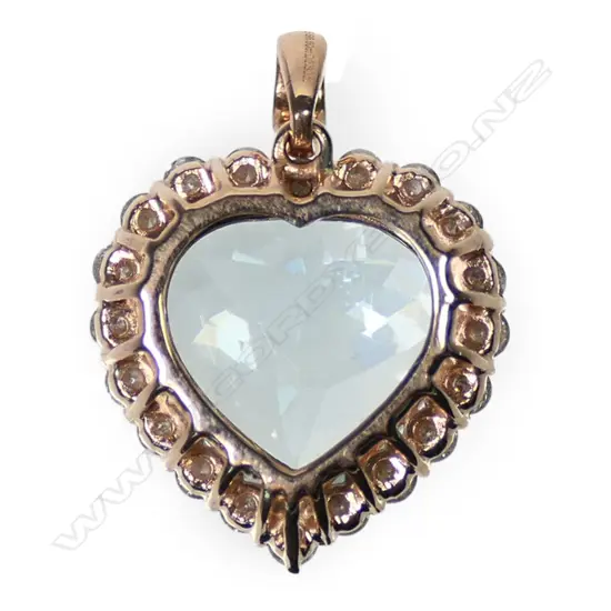 A 14ct rose gold aquamarine and diamond halo pendant