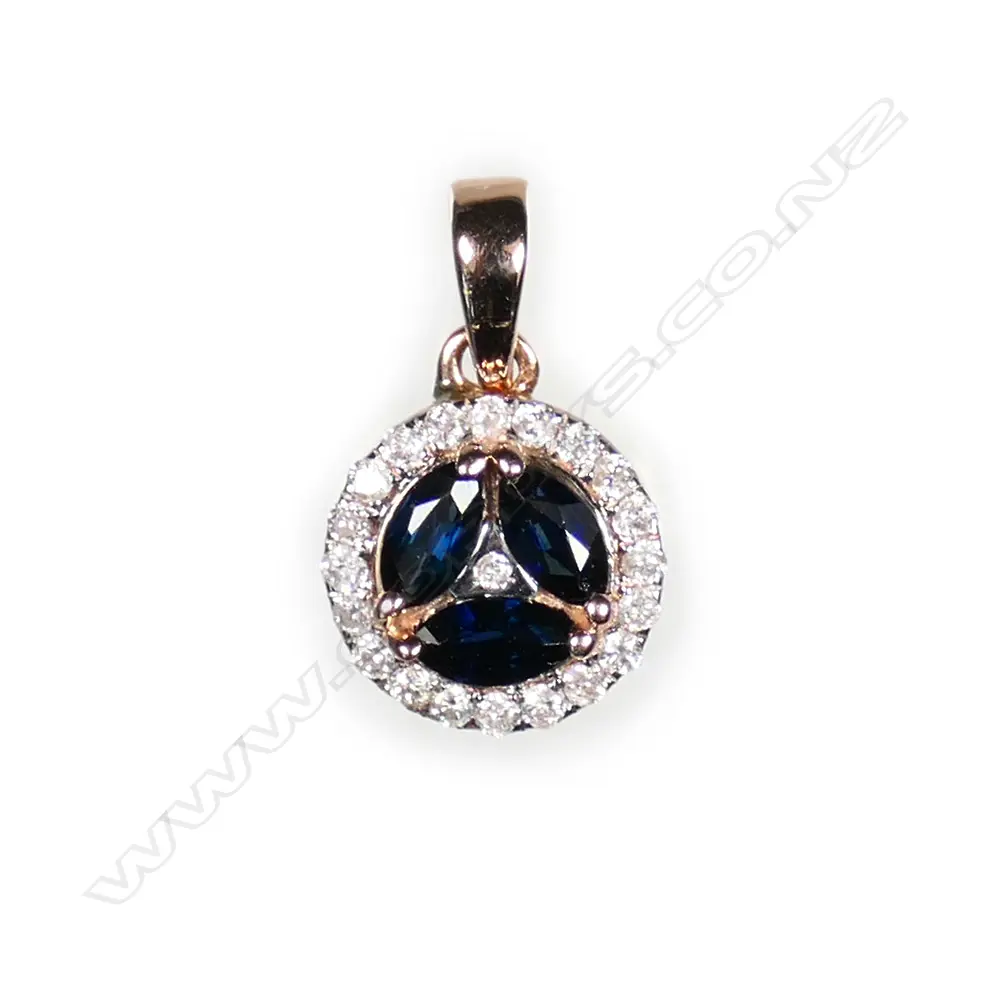 A 14ct rose gold sapphire and diamond halo pendant Image 1++