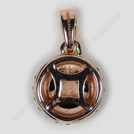 A 14ct rose gold sapphire and diamond halo pendant Image 1++