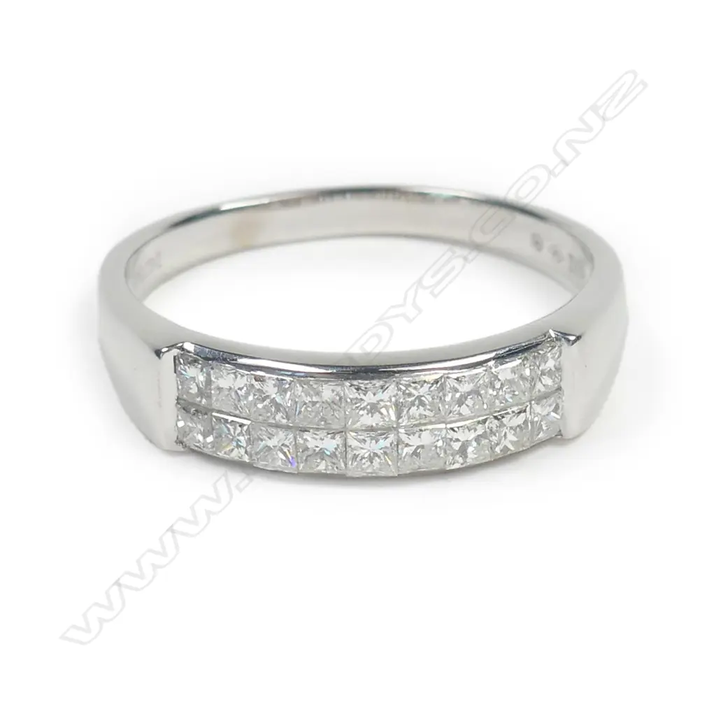 An 18ct white gold and diamond set band Image 1++