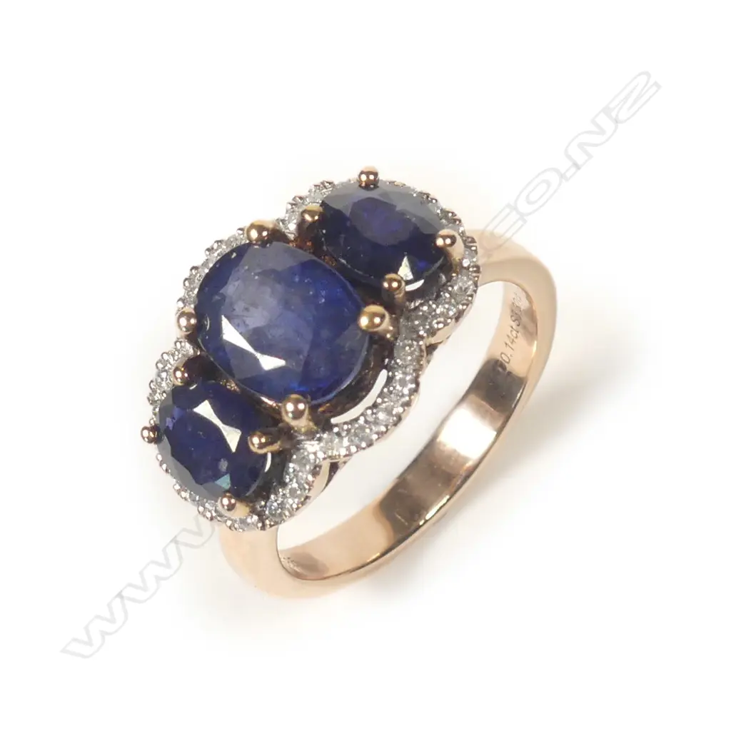A 14ct rose gold sapphire and diamond trilogy ring Image 1++