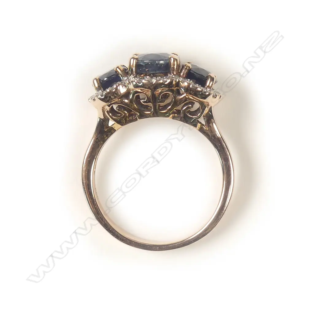 A 14ct rose gold sapphire and diamond trilogy ring Image 1++